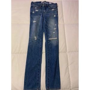 Distressed denim jeans